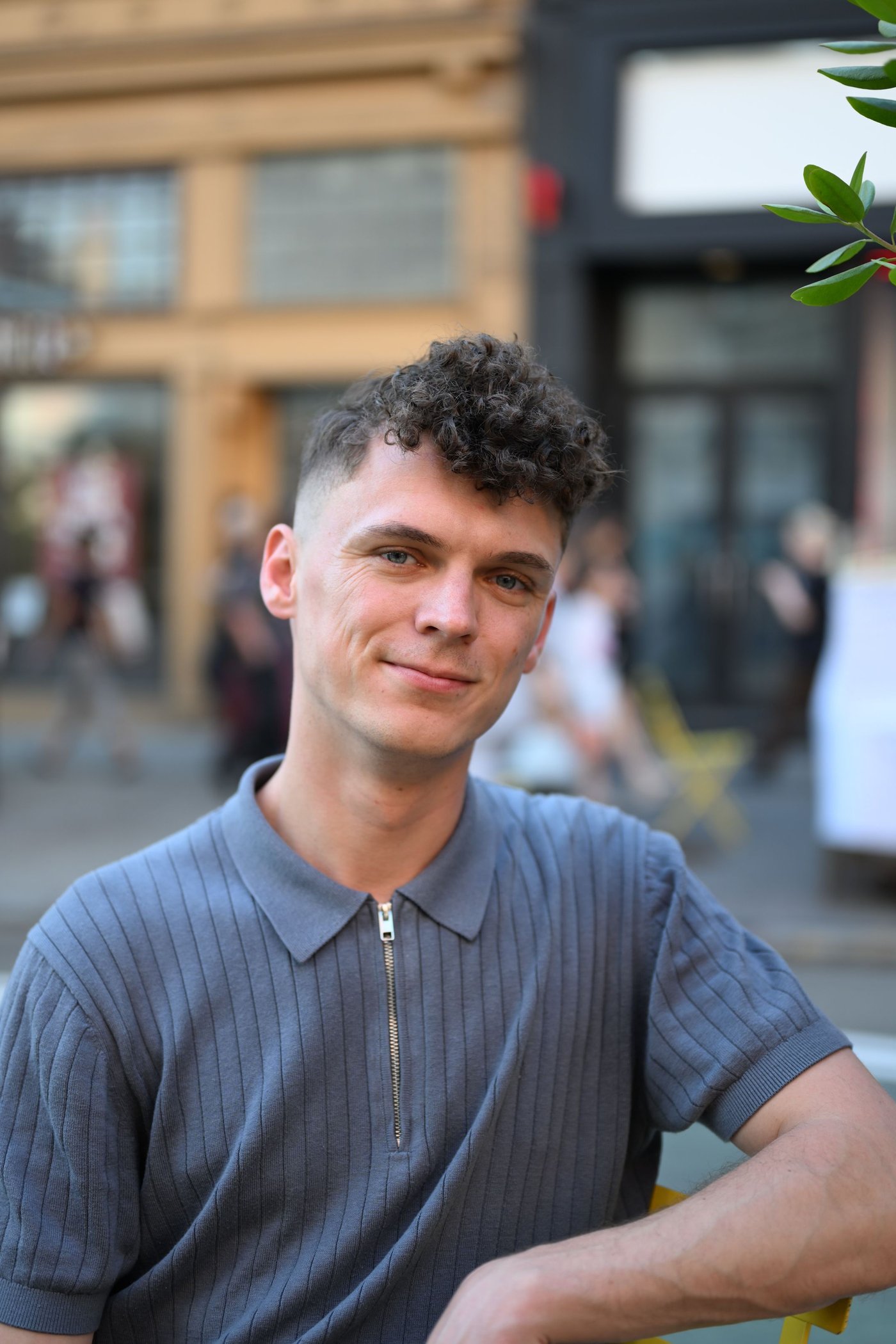 Tyler Armey, seated outdoors in New York
